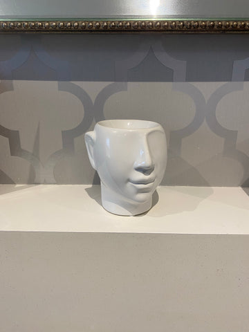 white ceramic wax burner in the shape of a head/face