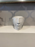 white ceramic wax burner in the shape of a head/face