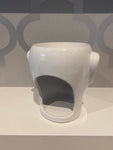 white ceramic wax burner in the shape of a head/face